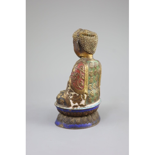 158 - A Chinese copper alloy and enamel seated figure of Buddha Shakyamuni, Qing dynasty,on a double lotus... 