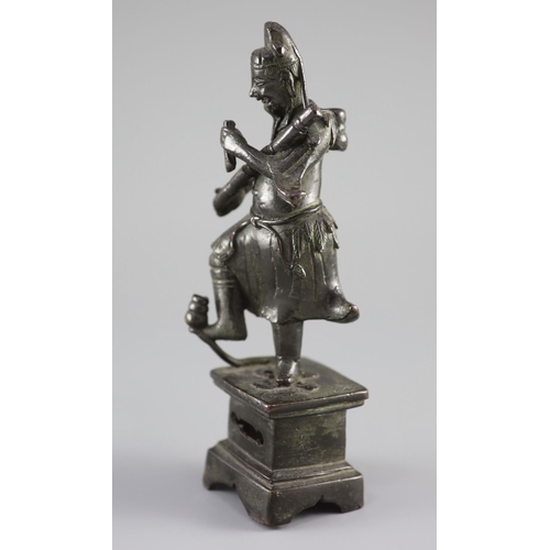 159 - A Chinese bronze figure of an immortal, late Ming dynasty,holding objects in each hand his right foo... 