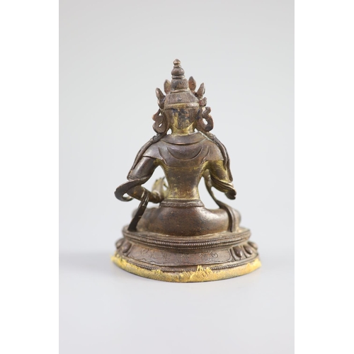 160 - A Chinese gilt bronze figure of Amitayus, Qianlong mark and period (1736-95),holding a vessel in his... 