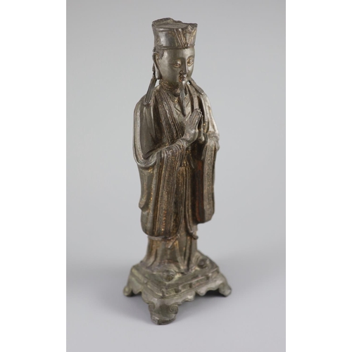 163 - A Chinese bronze standing figure of an immortal, late Ming, 17th century,with remnants of original p... 