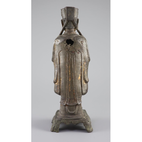 163 - A Chinese bronze standing figure of an immortal, late Ming, 17th century,with remnants of original p... 