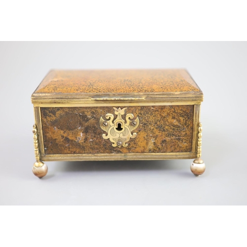 17 - A German ormolu mounted agate casket, 19th century,with chased scrolling escutcheon, raised on polis... 