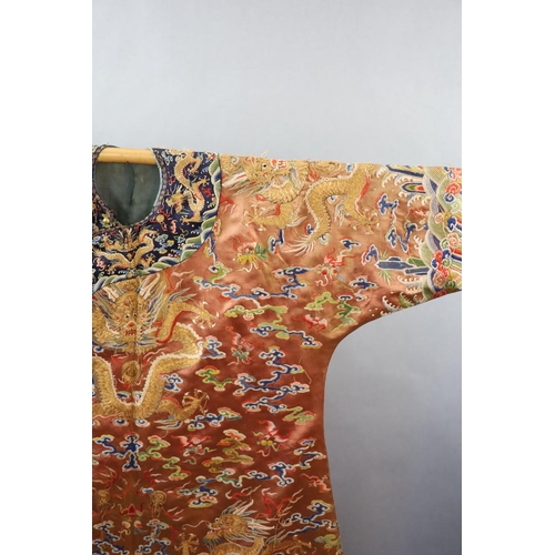 177 - A Chinese apricot embroidered silk dragon formal court robe, jifu, late Qing Dynasty,worked in sat... 