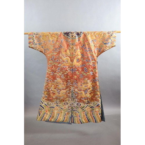 177 - A Chinese apricot embroidered silk dragon formal court robe, jifu, late Qing Dynasty,worked in sat... 