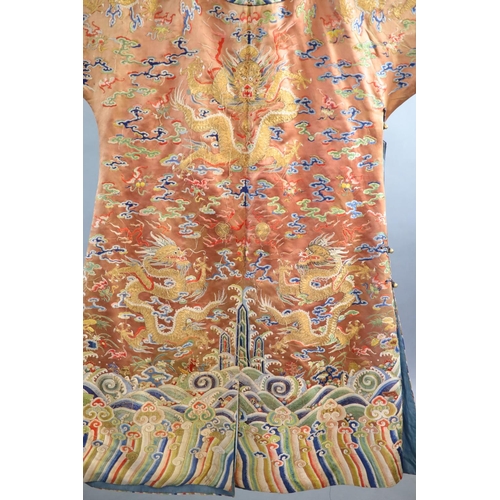 177 - A Chinese apricot embroidered silk dragon formal court robe, jifu, late Qing Dynasty,worked in sat... 