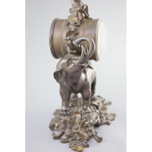 183 - A 19th century Louis XV style bronze pendule a lelephant,modelled with a Chinese figure seated ab... 