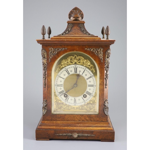 185 - A late 19th century walnut cased bracket clock,with a silvered chapter ring with black Roman and Ara... 