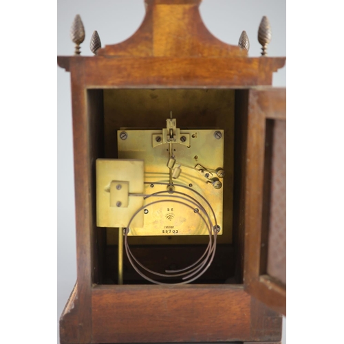 185 - A late 19th century walnut cased bracket clock,with a silvered chapter ring with black Roman and Ara... 