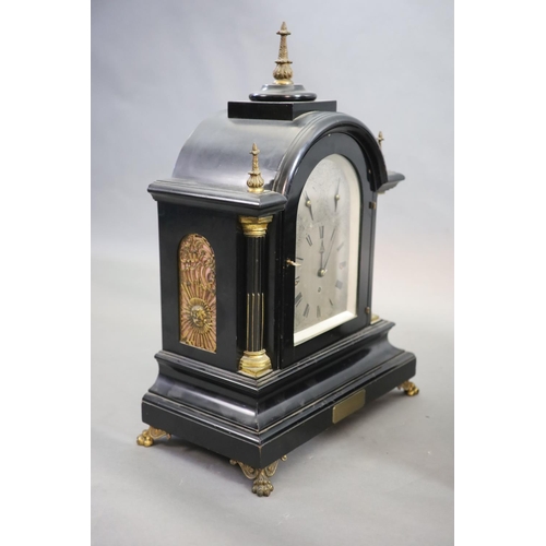 187 - A large late Victorian ebonised bracket clock with bracketthe arched silvered dial with Roman numera... 