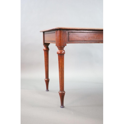 197 - A Victorian mahogany writing table,with rounded rectangular top, once fitted with an inkwell, on tur... 