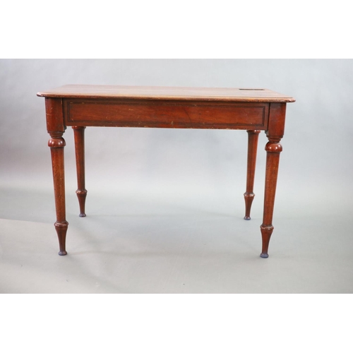 197 - A Victorian mahogany writing table,with rounded rectangular top, once fitted with an inkwell, on tur... 