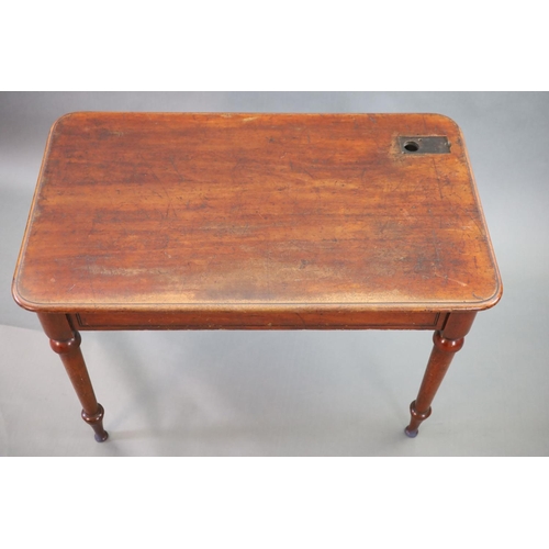 197 - A Victorian mahogany writing table,with rounded rectangular top, once fitted with an inkwell, on tur... 