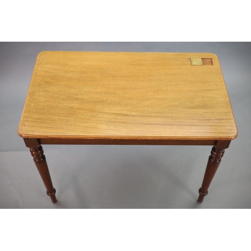 201 - A Victorian mahogany writing table,with rounded rectangular top inset with a brass lidded inkwell, o... 