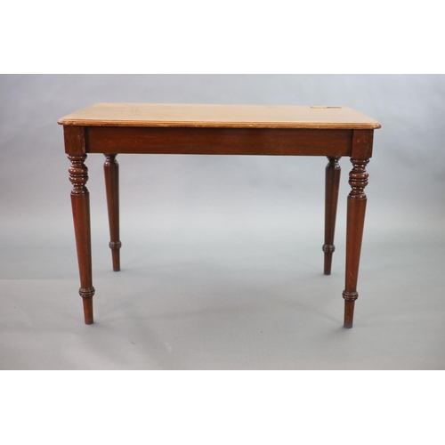 201 - A Victorian mahogany writing table,with rounded rectangular top inset with a brass lidded inkwell, o... 