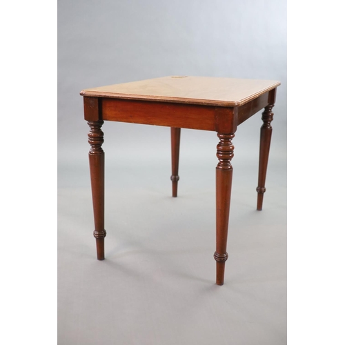 201 - A Victorian mahogany writing table,with rounded rectangular top inset with a brass lidded inkwell, o... 