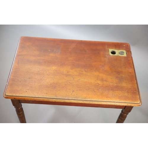 203 - A Victorian mahogany writing table,with rounded rectangular top and brass inset inkwell, on turned t... 