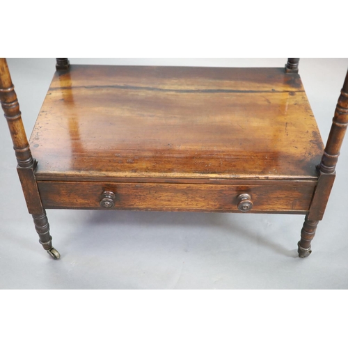 204 - An early Victorian rosewood whatnot,with three stages and base drawer, on ring turned tapered legs a... 