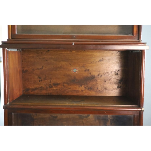 205 - A Globe Wernicke mahogany sectional bookcase,with inset glazed top section over two glazed doors and... 