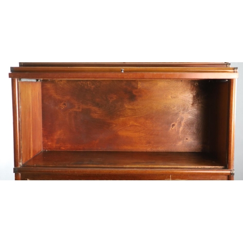 207 - A Globe Wernicke mahogany sectional bookcase,with inset glazed top section over two glazed doors and... 