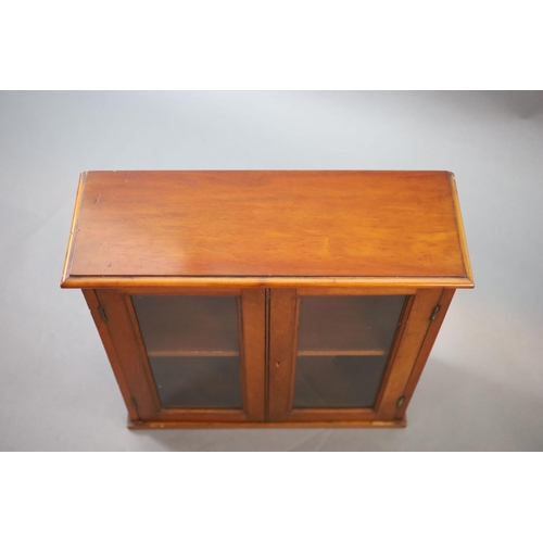 210 - A small Edwardian mahogany wall cabinet,with two glazed doors,W.58cm D.21cm H.57cm The Royal College... 