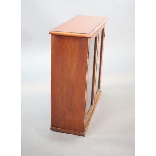 210 - A small Edwardian mahogany wall cabinet,with two glazed doors,W.58cm D.21cm H.57cm The Royal College... 