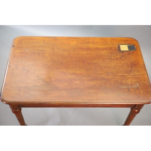 213 - A Victorian mahogany writing table,with rounded rectangular top inset with a brass capped inkwell, o... 