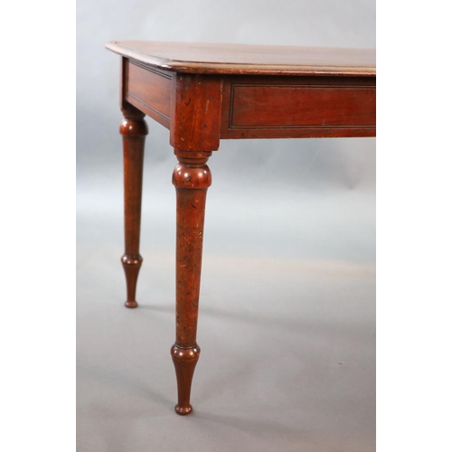 213 - A Victorian mahogany writing table,with rounded rectangular top inset with a brass capped inkwell, o... 