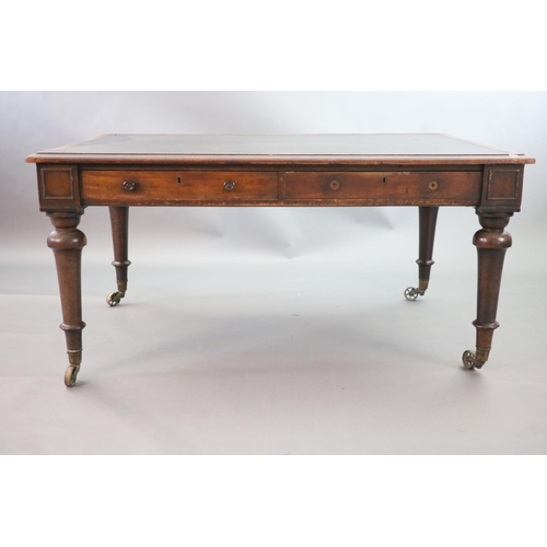 215 - A Victorian mahogany library table,the rectangular top inset with an old black leather skiver, friez... 