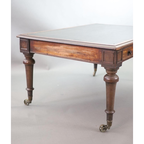 215 - A Victorian mahogany library table,the rectangular top inset with an old black leather skiver, friez... 