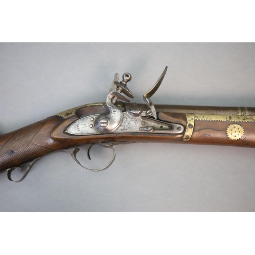 22 - An early 19th century Indian flintlock blunderbuss, East India Company,the barrel with remnants of p... 