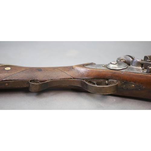 22 - An early 19th century Indian flintlock blunderbuss, East India Company,the barrel with remnants of p... 