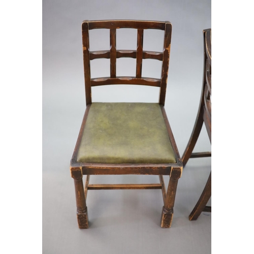 223 - A set of eight early 20th century oak and beech dining chairs,with cross frame backs and drop in sea... 