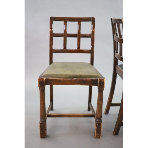 223 - A set of eight early 20th century oak and beech dining chairs,with cross frame backs and drop in sea... 