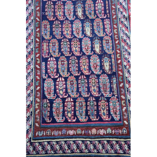 226 - An antique Karabagh blue ground runner, late 19th centurywoven with rows of Boteh within a floral an... 