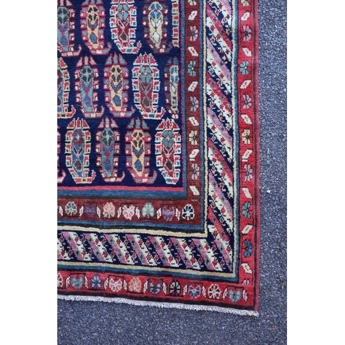 226 - An antique Karabagh blue ground runner, late 19th centurywoven with rows of Boteh within a floral an... 