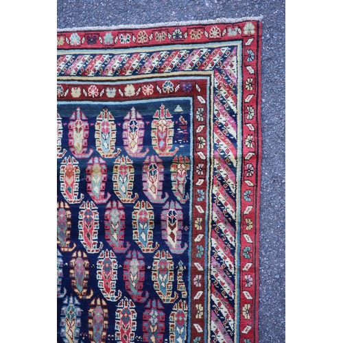 226 - An antique Karabagh blue ground runner, late 19th centurywoven with rows of Boteh within a floral an... 