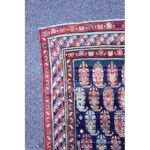 226 - An antique Karabagh blue ground runner, late 19th centurywoven with rows of Boteh within a floral an... 