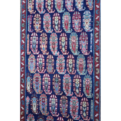 226 - An antique Karabagh blue ground runner, late 19th centurywoven with rows of Boteh within a floral an... 