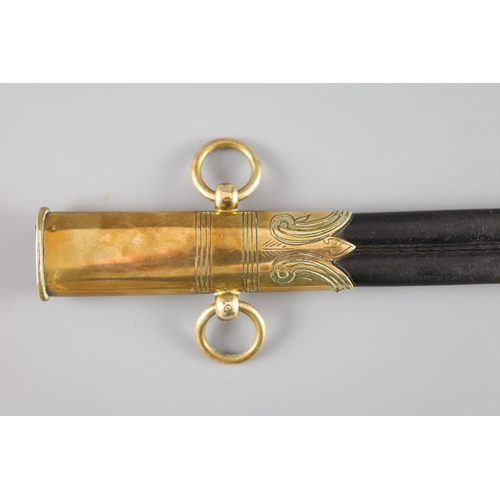 23 - An Edward VII Naval officers dress dirkwith EVIIR cipher, and brass-mounted leather scabbard, toget... 