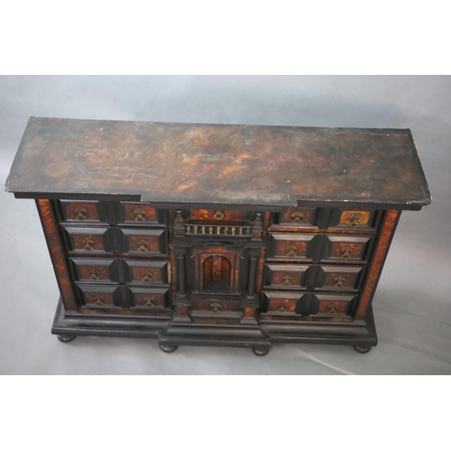 235 - A late 17th century Portuguese ebony and tortoiseshell table cabinet,of breakfront rectangular form ... 