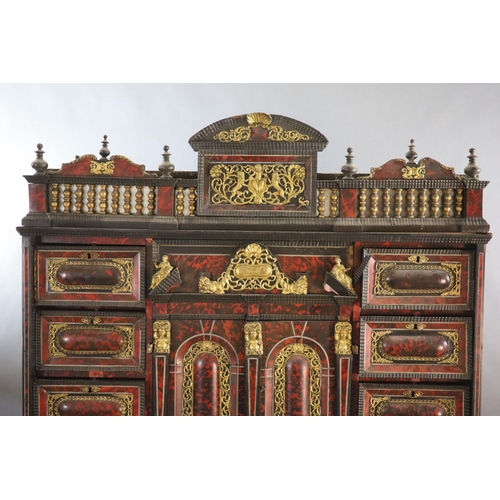 236 - A late 17th century Portuguese ormolu mounted ebony and red tortoiseshell cabinet on stand,of archit... 