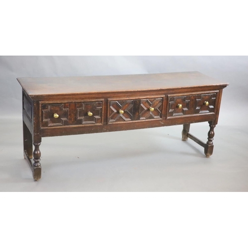 237 - A late 17th century oak dresser,fitted with three geometric moulded short drawers, raised on turned ... 