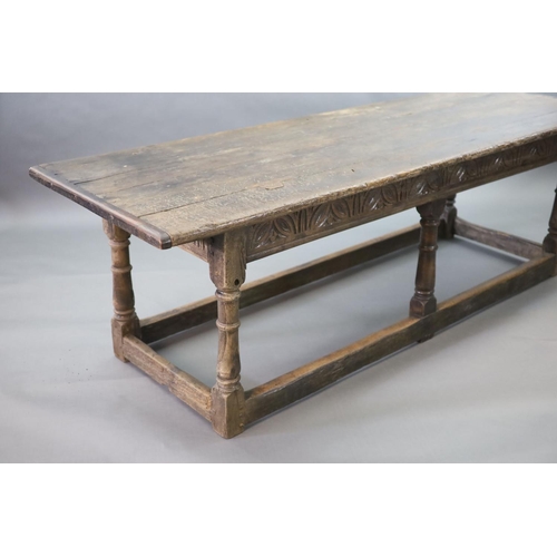 239 - A 17th century oak and elm refectory table,with rectangular top, foliate carved frieze and cannon ba... 