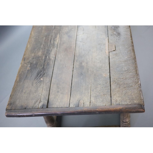 239 - A 17th century oak and elm refectory table,with rectangular top, foliate carved frieze and cannon ba... 