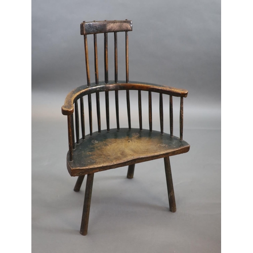 240 - An 18th century primitive vernacular comb-back elbow chair, possibly Welsh,with remnants of original... 