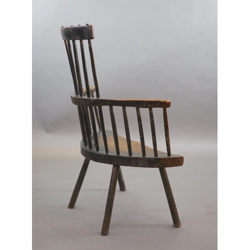 240 - An 18th century primitive vernacular comb-back elbow chair, possibly Welsh,with remnants of original... 