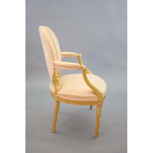 245 - A George III giltwood open armchair,with upholstered back, arms and seat, the moulded frame carved w... 