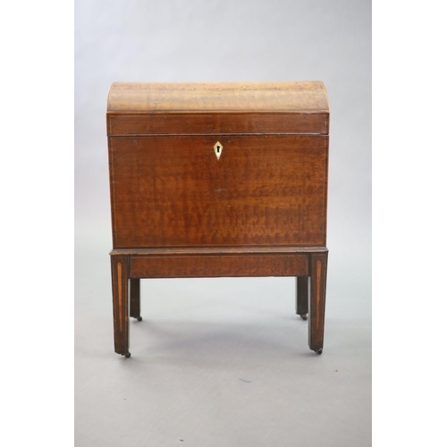 246 - A George III strung "plum pudding" mahogany cellaret,of domed rectangular form, the interi... 