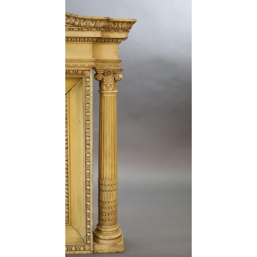 253 - A Victorian Adam style cream painted beech overmantel,with broken arch cornice and central bevelled ... 