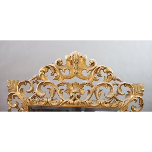 259 - A late 19th century Florentine giltwood wall mirror,with foliate scroll frame and bevelled glass pla... 